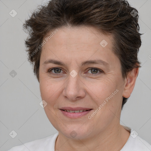 Joyful white adult female with short  brown hair and brown eyes