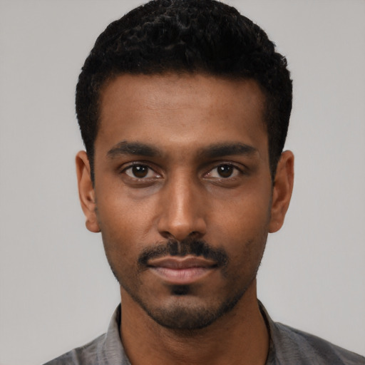 Neutral black young-adult male with short  black hair and brown eyes