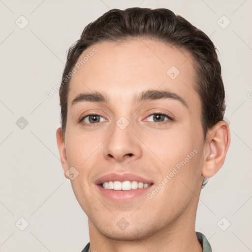 Joyful white young-adult male with short  brown hair and brown eyes