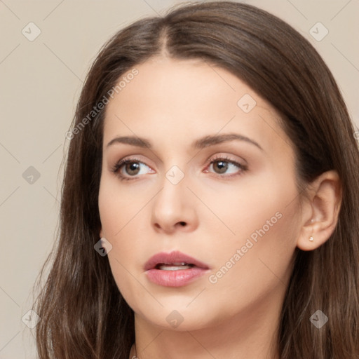 Neutral white young-adult female with long  brown hair and brown eyes