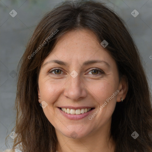 Joyful white adult female with medium  brown hair and brown eyes