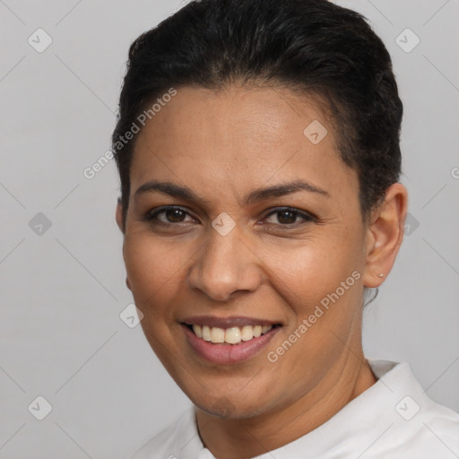 Joyful latino young-adult female with short  brown hair and brown eyes