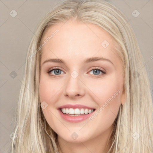 Joyful white young-adult female with long  brown hair and blue eyes