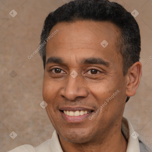 Joyful latino adult male with short  black hair and brown eyes