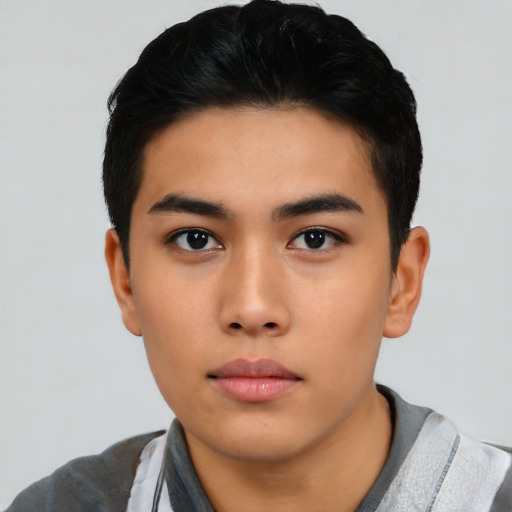 Neutral asian young-adult male with short  black hair and brown eyes