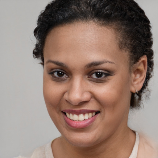 Joyful latino young-adult female with short  brown hair and brown eyes
