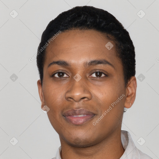 Joyful black young-adult female with short  black hair and brown eyes