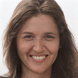 Joyful white adult female with long  brown hair and brown eyes