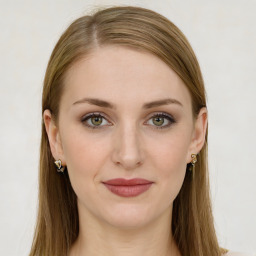 Joyful white young-adult female with long  brown hair and green eyes