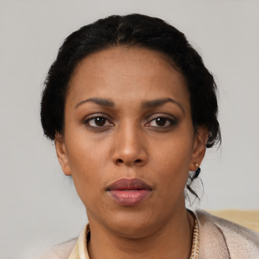 Neutral latino young-adult female with short  black hair and brown eyes