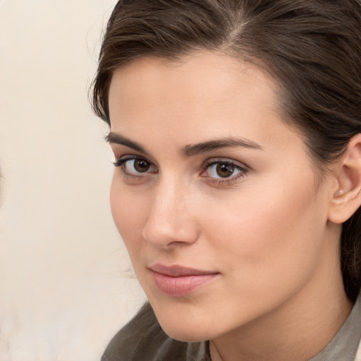 Neutral white young-adult female with medium  brown hair and brown eyes