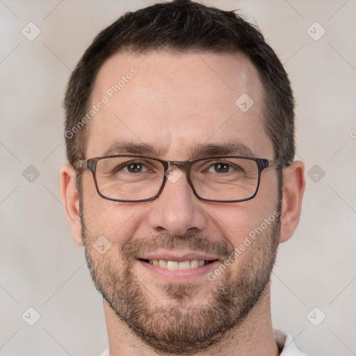 Joyful white adult male with short  brown hair and brown eyes