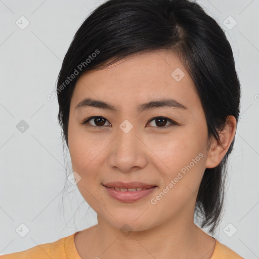 Joyful asian young-adult female with medium  brown hair and brown eyes