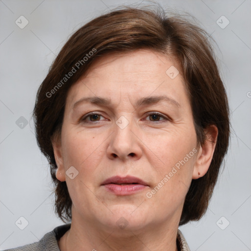 Joyful white adult female with medium  brown hair and grey eyes