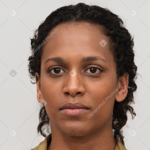 Neutral black young-adult female with long  brown hair and brown eyes