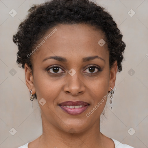 Joyful black young-adult female with short  brown hair and brown eyes