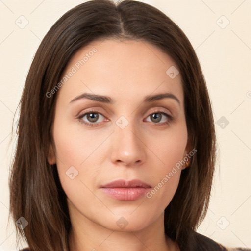 Neutral white young-adult female with long  brown hair and brown eyes