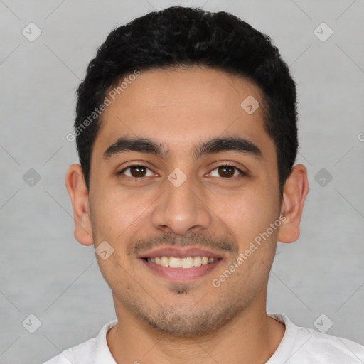 Joyful latino young-adult male with short  black hair and brown eyes