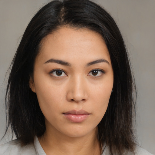Neutral asian young-adult female with medium  brown hair and brown eyes