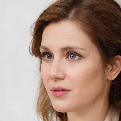 Neutral white young-adult female with medium  brown hair and grey eyes