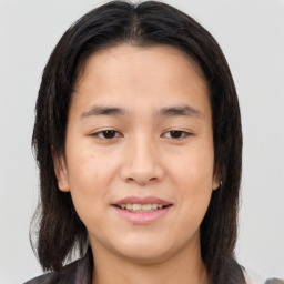 Joyful asian young-adult female with medium  brown hair and brown eyes