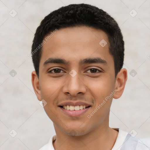 Joyful latino young-adult male with short  black hair and brown eyes