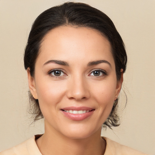 Joyful white young-adult female with medium  brown hair and brown eyes