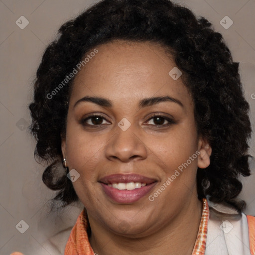 Joyful black young-adult female with long  black hair and brown eyes