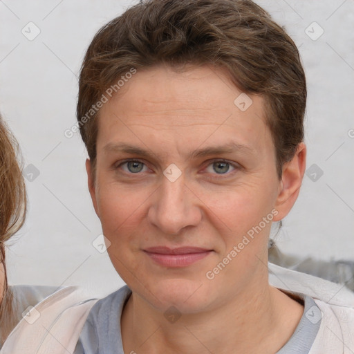 Joyful white adult female with short  brown hair and brown eyes