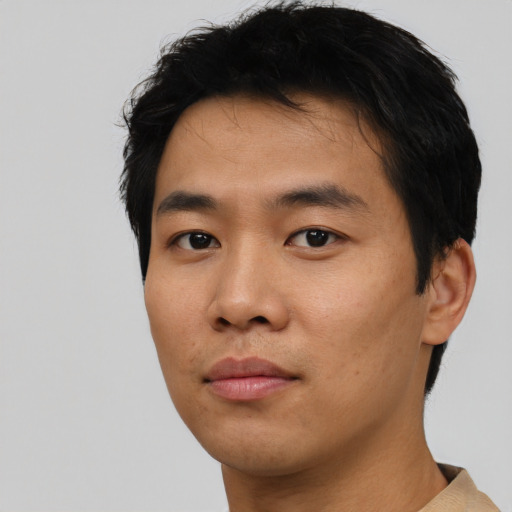 Neutral asian young-adult male with short  black hair and brown eyes