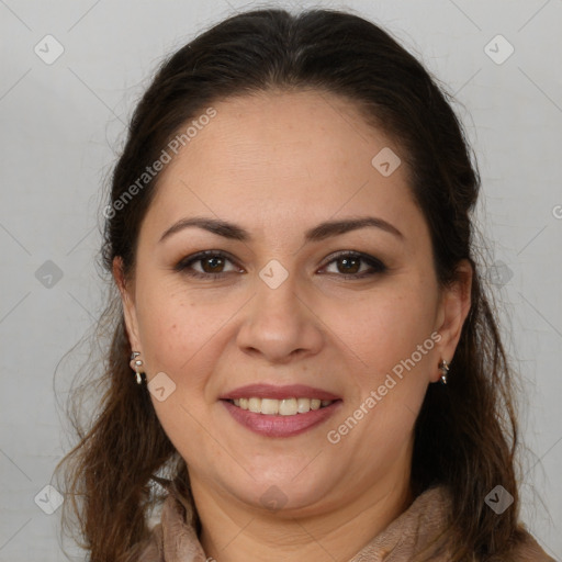 Joyful white adult female with long  brown hair and brown eyes