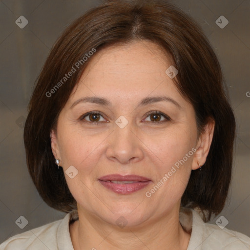 Joyful white adult female with medium  brown hair and brown eyes