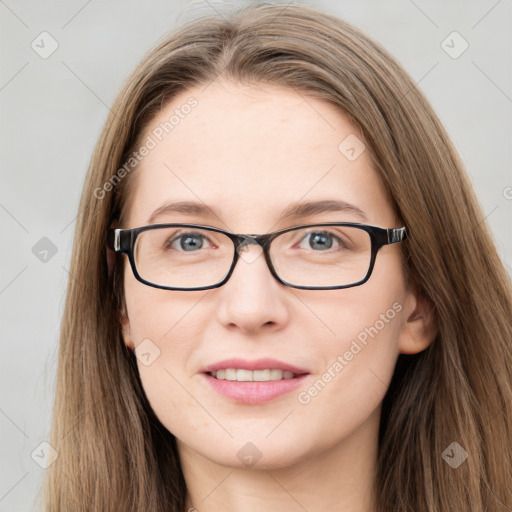 Joyful white young-adult female with long  brown hair and blue eyes