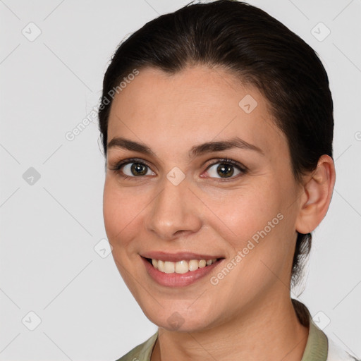 Joyful white young-adult female with medium  brown hair and brown eyes