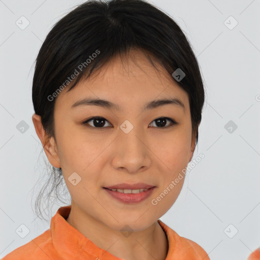 Joyful asian young-adult female with short  brown hair and brown eyes