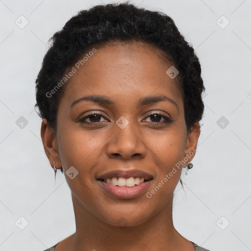 Joyful black young-adult female with short  brown hair and brown eyes