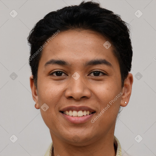 Joyful latino young-adult male with short  black hair and brown eyes