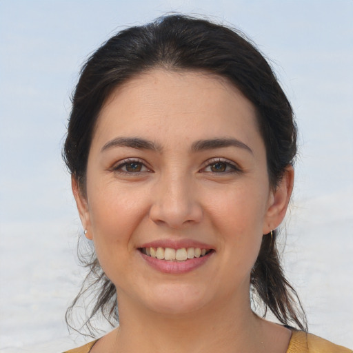Joyful white young-adult female with medium  brown hair and brown eyes