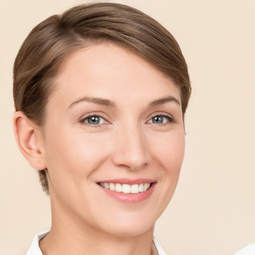 Joyful white young-adult female with short  brown hair and brown eyes