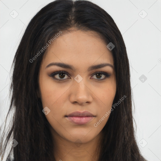 Joyful latino young-adult female with long  brown hair and brown eyes