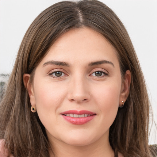 Joyful white young-adult female with long  brown hair and grey eyes