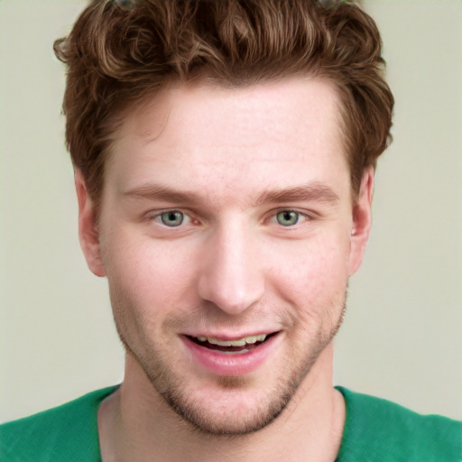 Joyful white young-adult male with short  brown hair and green eyes