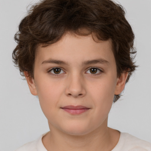 Joyful white child male with short  brown hair and brown eyes