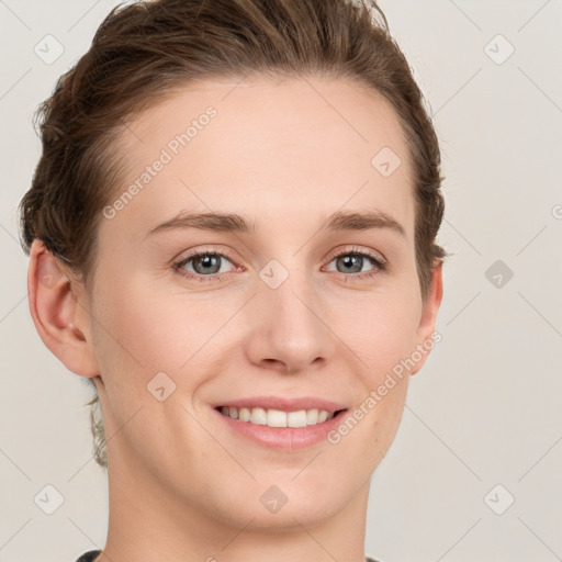 Joyful white young-adult female with short  brown hair and grey eyes