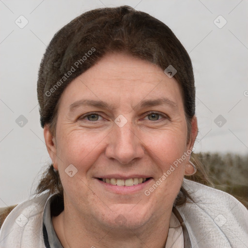 Joyful white adult female with short  brown hair and brown eyes