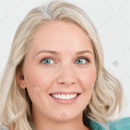 Joyful white young-adult female with long  blond hair and blue eyes