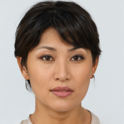 Neutral asian young-adult female with medium  brown hair and brown eyes