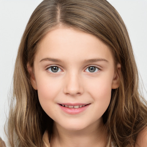 Joyful white child female with long  brown hair and brown eyes