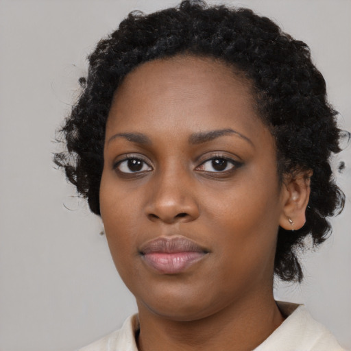 Neutral black young-adult female with medium  black hair and brown eyes
