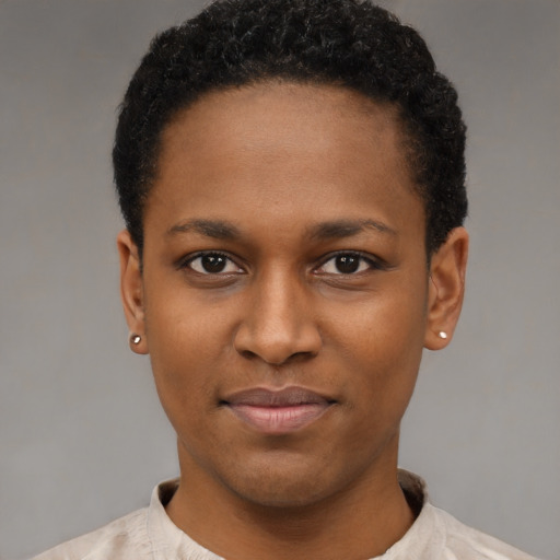 Joyful latino young-adult female with short  black hair and brown eyes